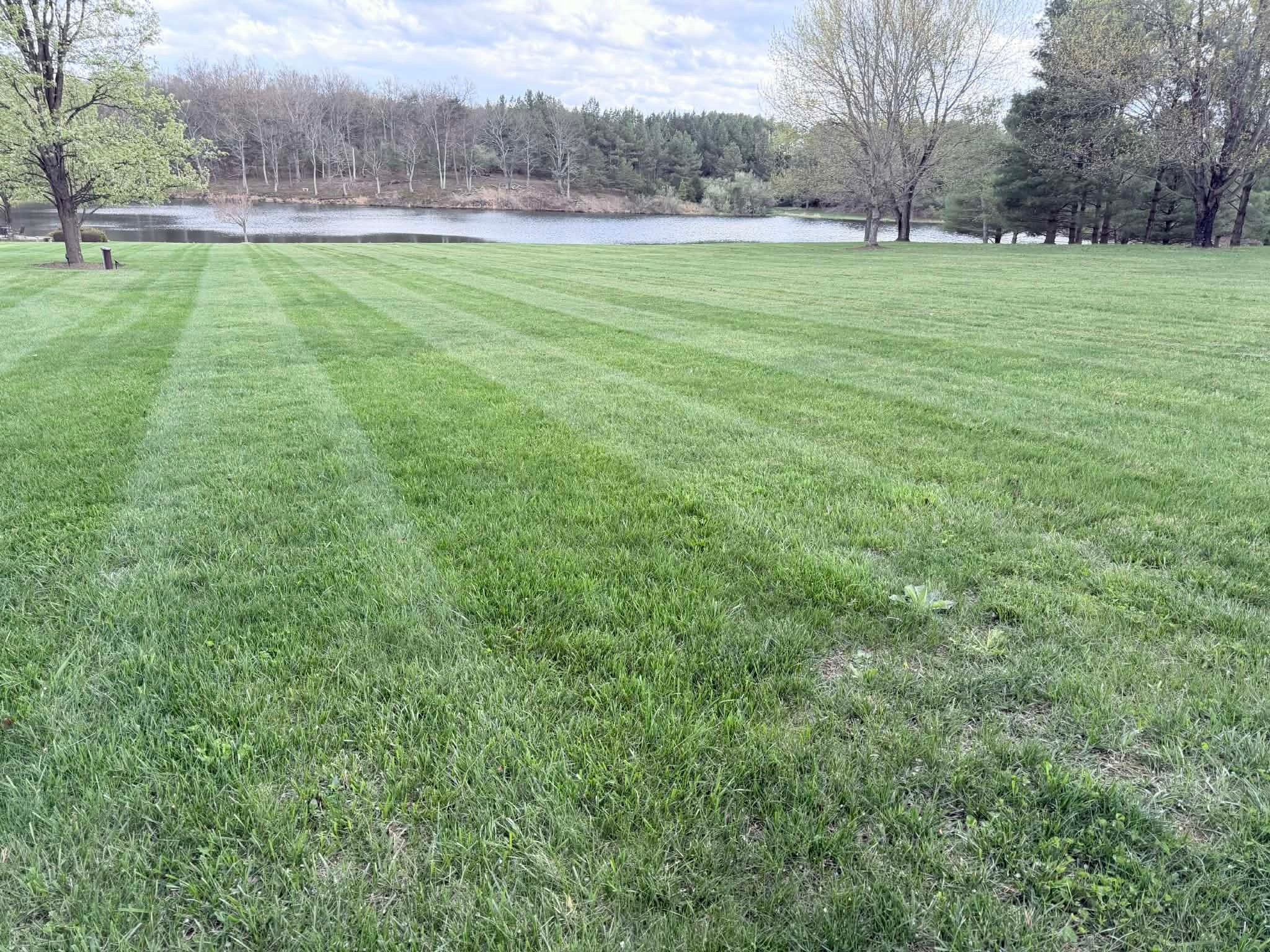 Lakefront property mowing with striping in Winchester VA